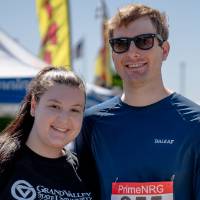 Two racers smile for a photo after the race.